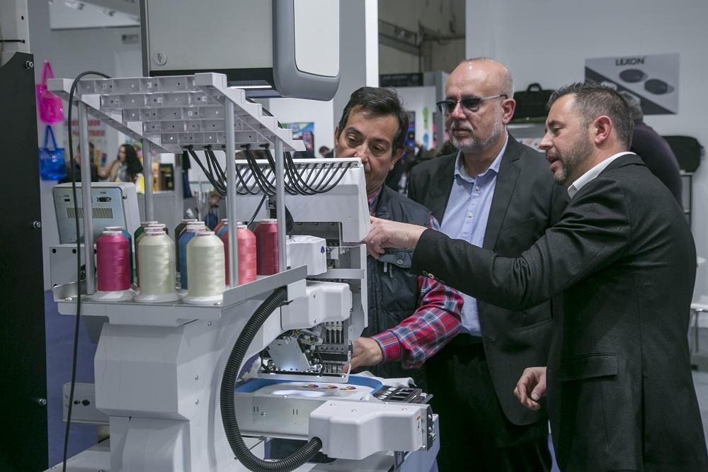 people viewing a machine demo
